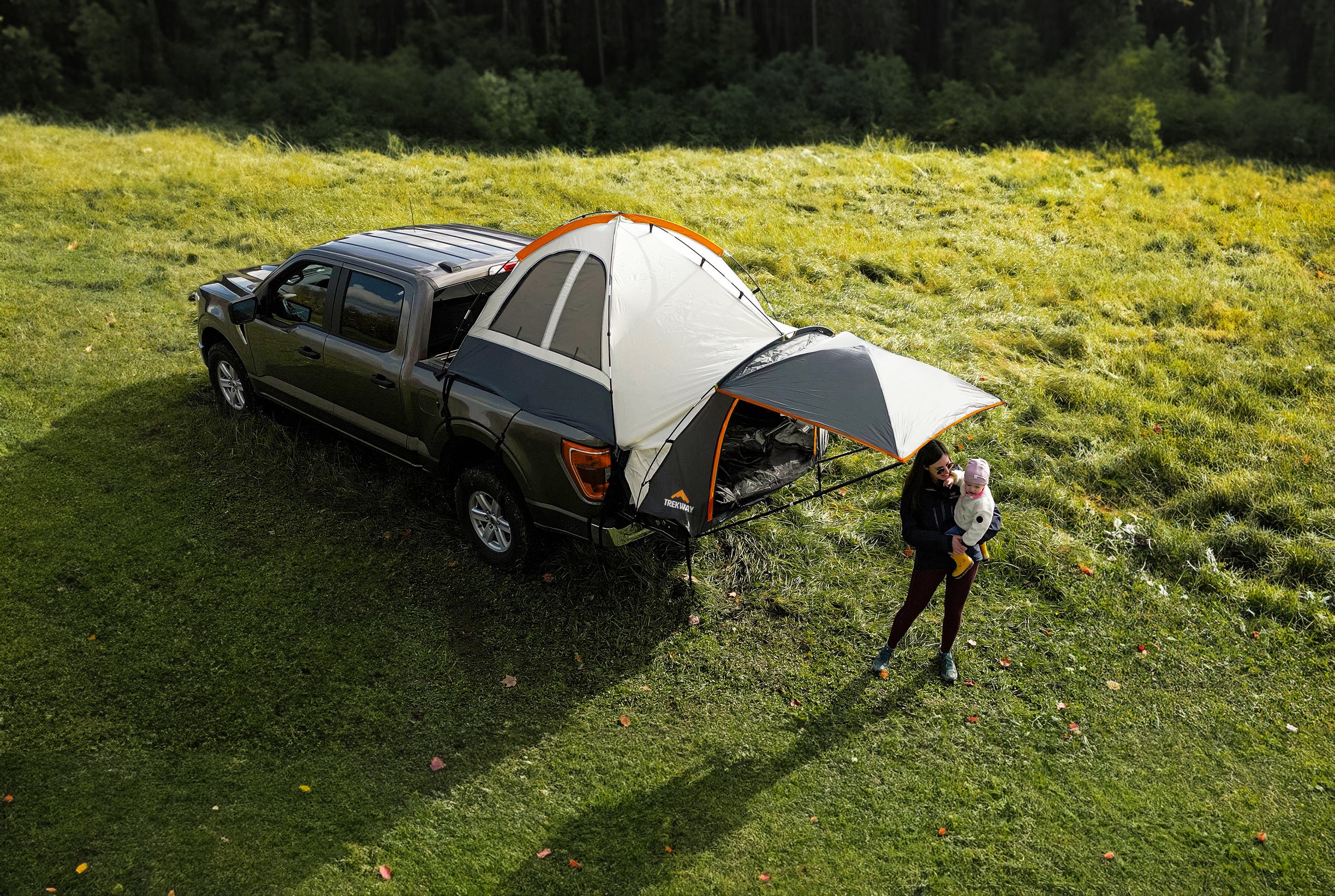 Young Women and her Baby camping in a F150 Ford Truck Tent