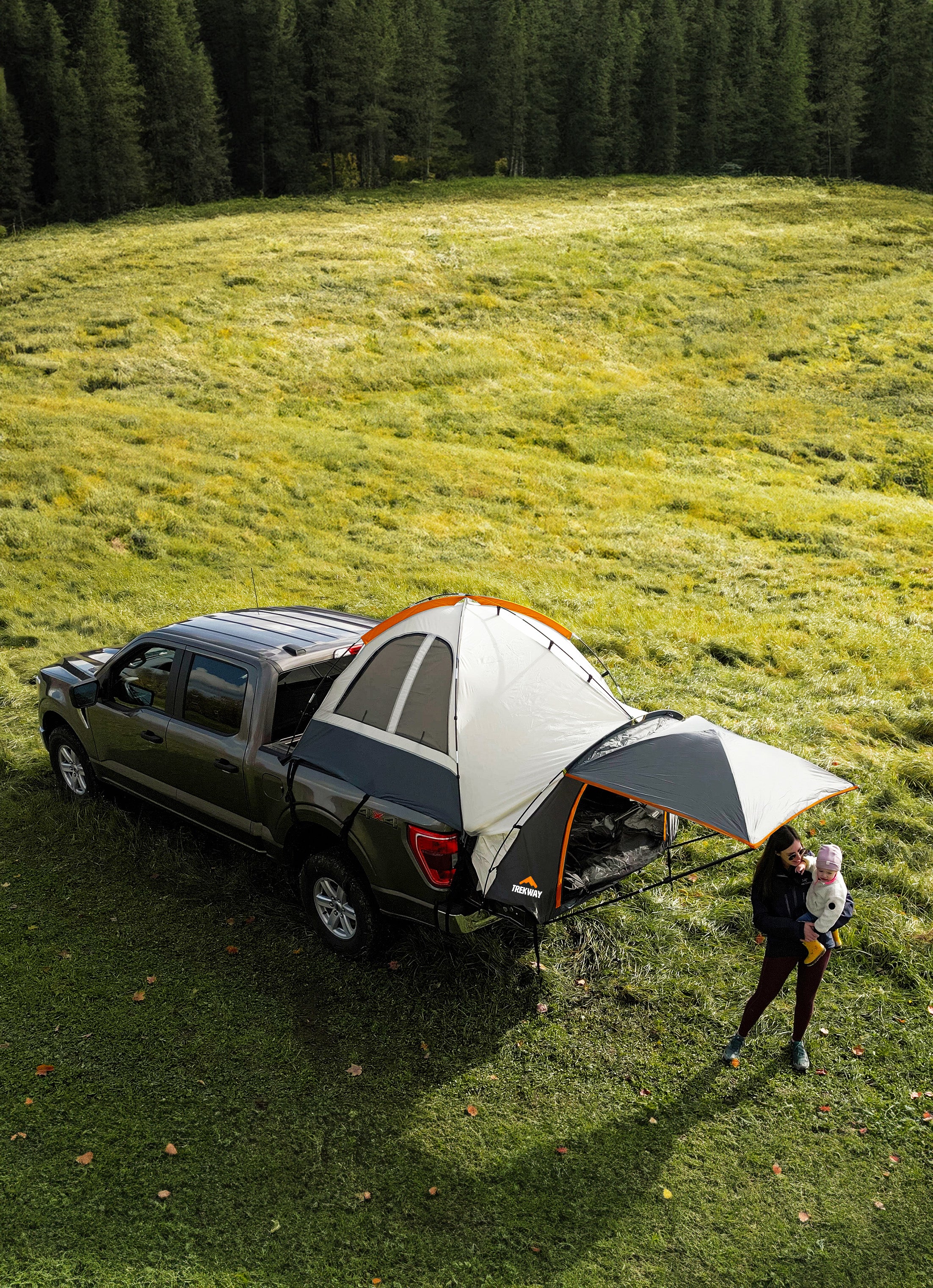 Young Women and her Baby camping in a F150 Ford Truck Tent